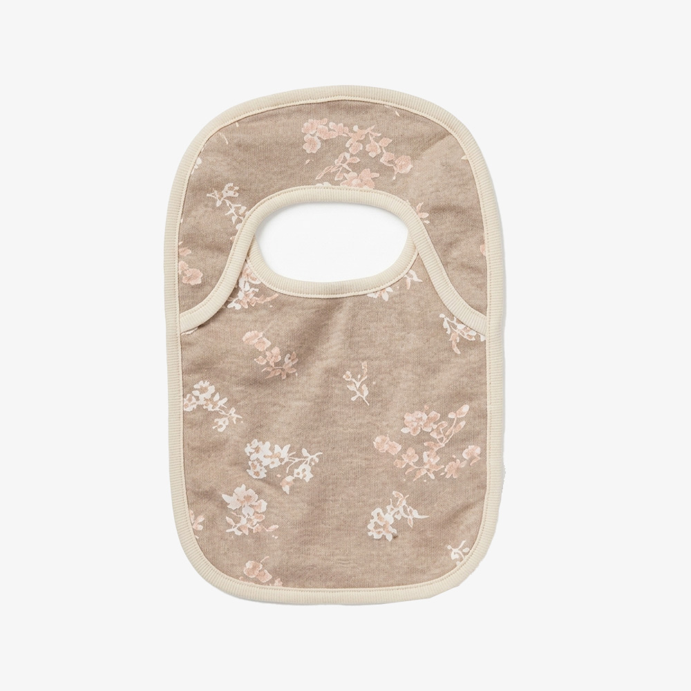 AOP floral infant drool bib featuring exquisite piping detail for private label branding