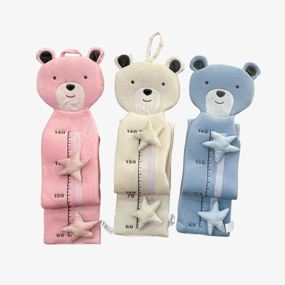 Wholesale assortment of plush animal growth charts in pink, cream, and blue for B2B retailers