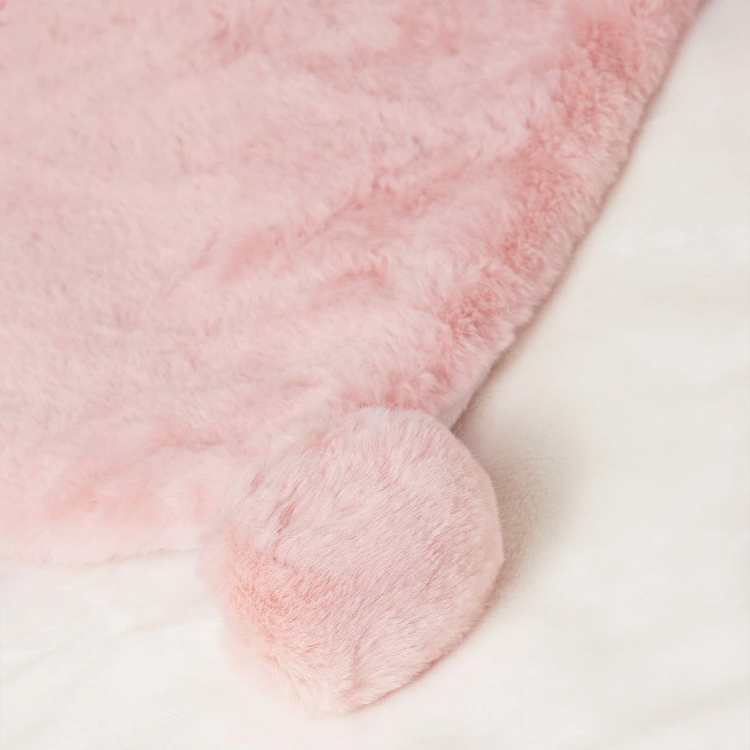 Exquisite pom-pom edge detailing on plush flannel blankets for specialized ODM projects