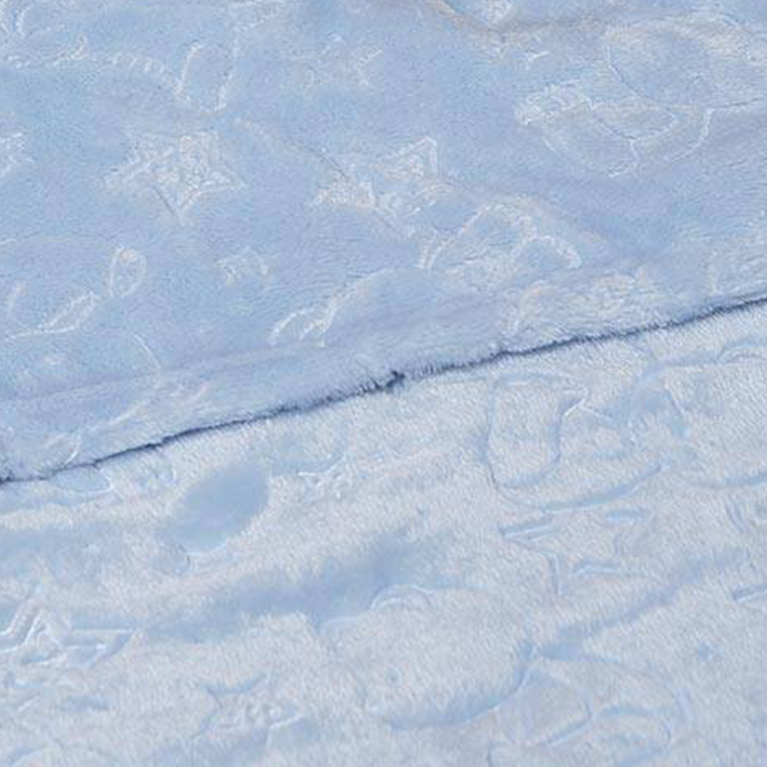 Intricate embossed pattern detailing on soft flannel fabric from specialized textile facility