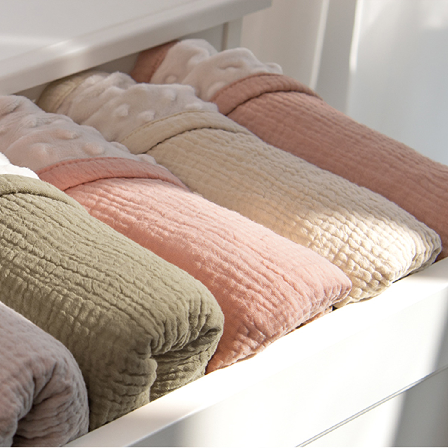 ssorted colors of muslin minky blankets in bulk inventory for nursery retailers