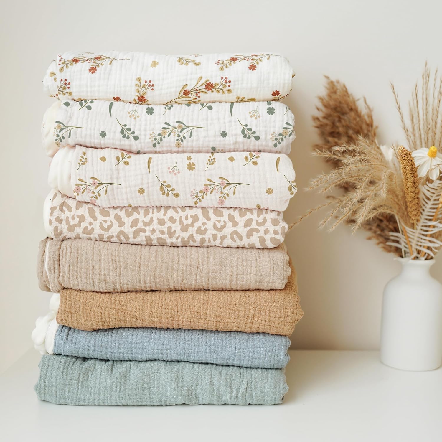 Variety of printed muslin fabrics for bespoke baby blanket production and private labeling