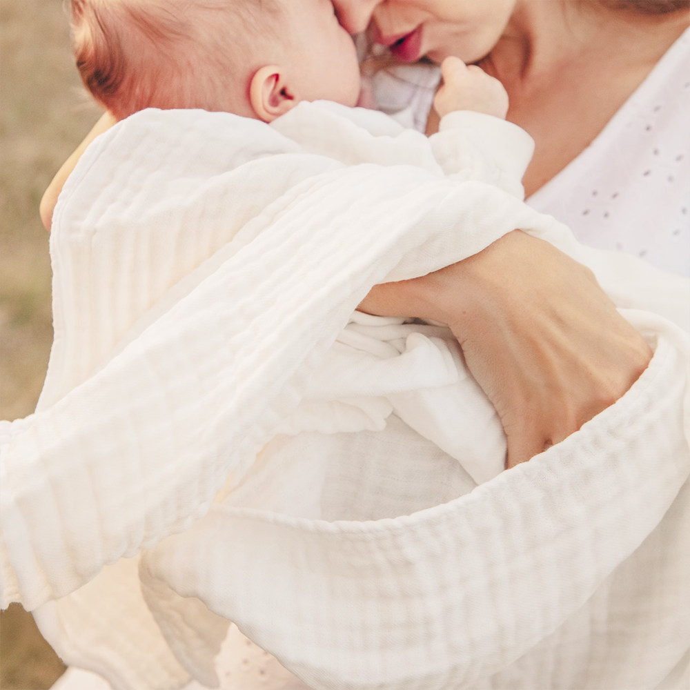 Premium white muslin cotton throw produced by certified baby bedding factory